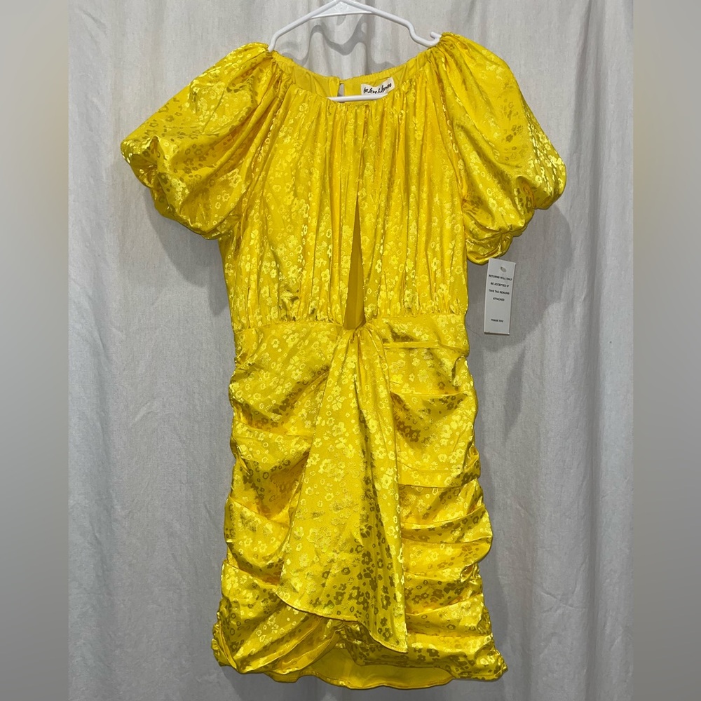 NWT. For Love & Lemons Fiji Mini Dress. Key hole front. Ruched sides.